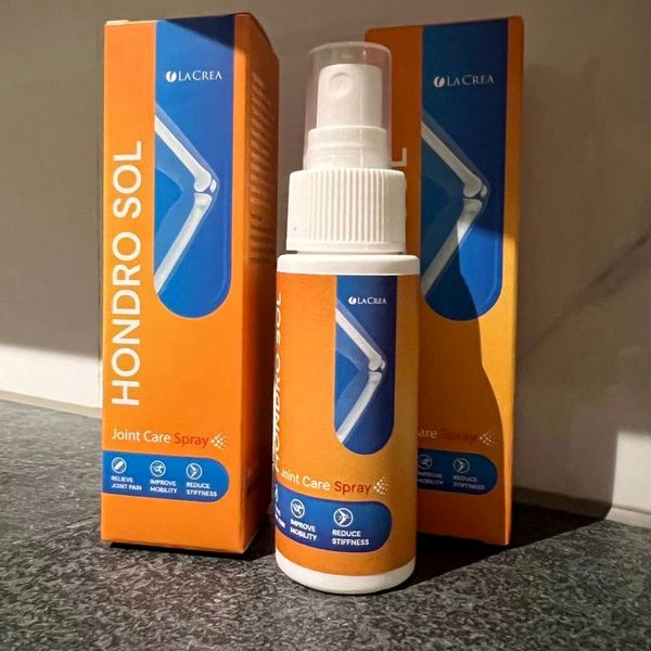 Hondro Sol spray fehér flakonja két narancssárga-kék doboz között